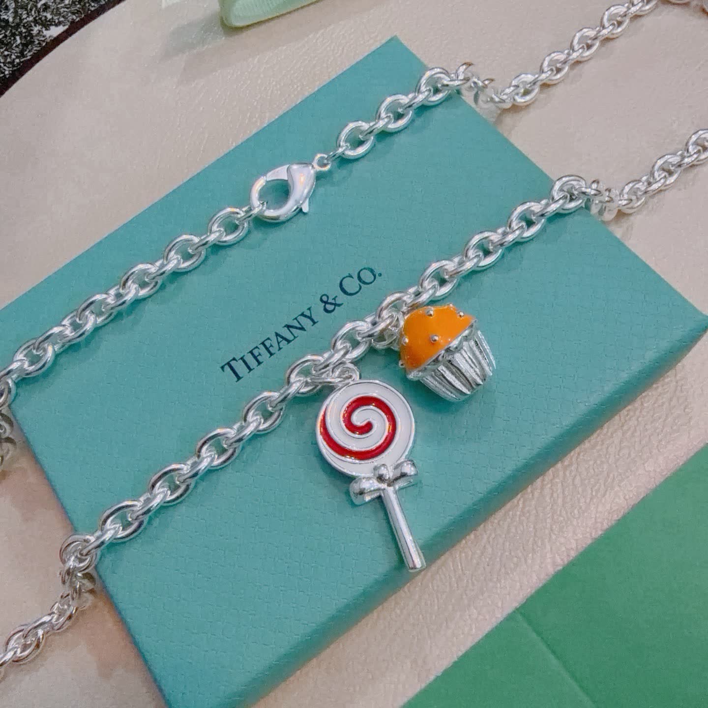 Tiffany & Co. Silver Charm Necklace with Lollipop and Cupcake Charms